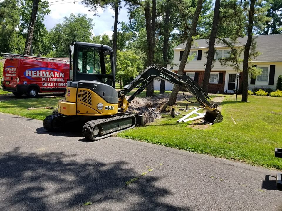 Exterior plumbing excavation at a home